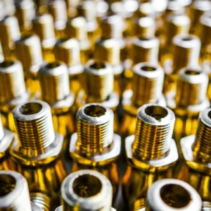 Rows of threaded hydraulic adaptor fittings in close-up