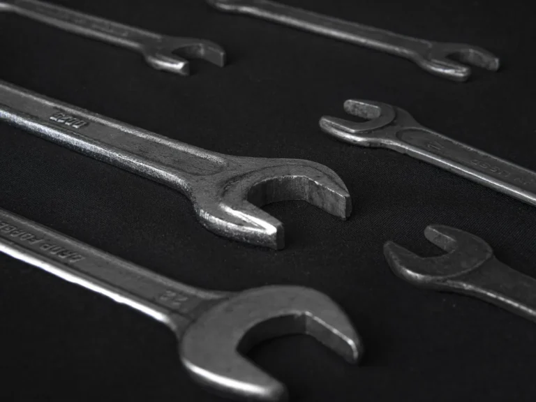 Heavy-duty forged steel open-end wrenches on a dark background