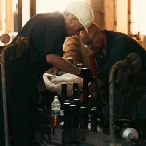 Maintenance engineers servicing industrial machinery in a plant